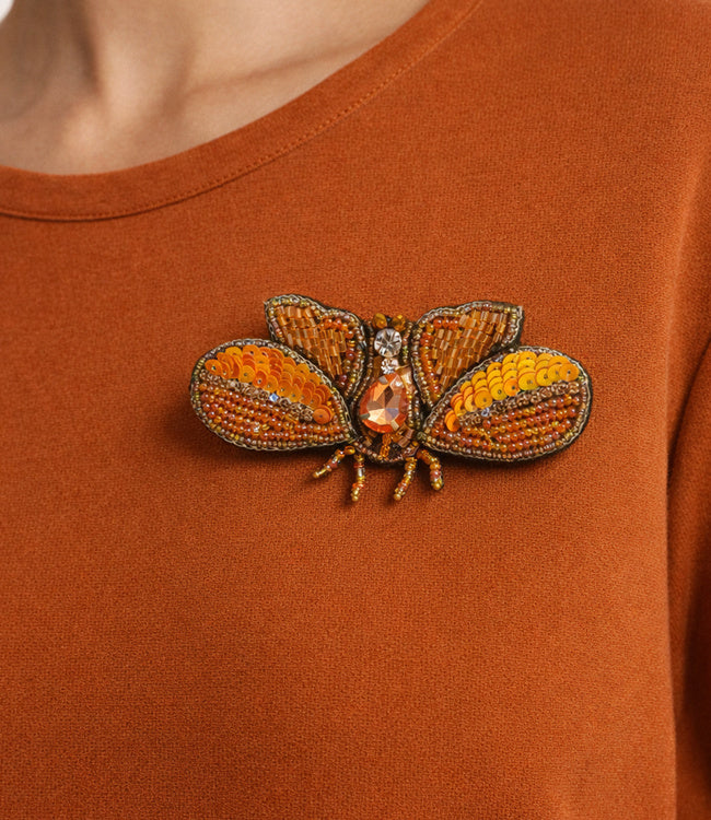 FAIRTRADE broche MOT ORANJE met pailetten en kralen