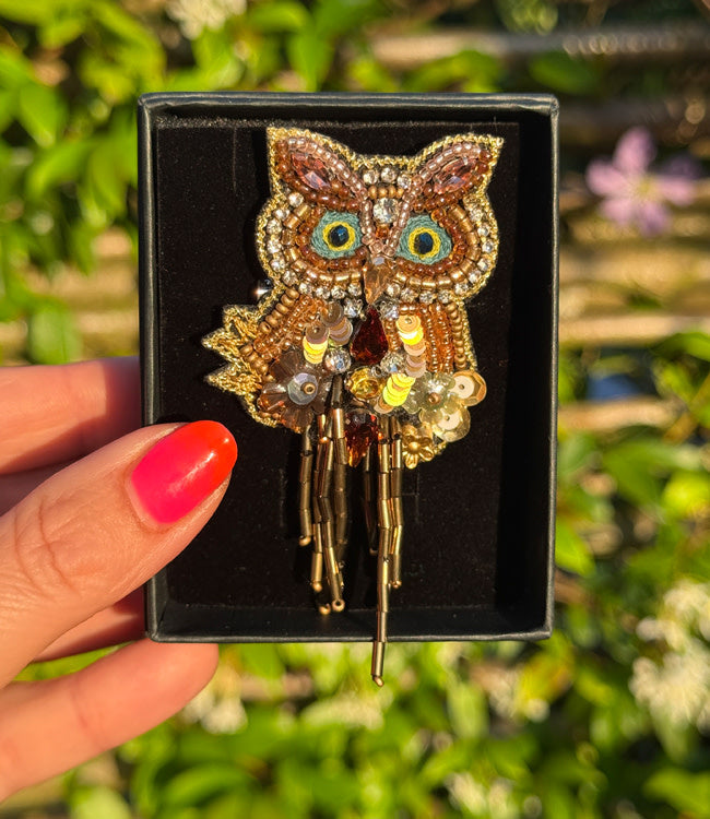 FAIRTRADE broche UIL met pailetten en kralen