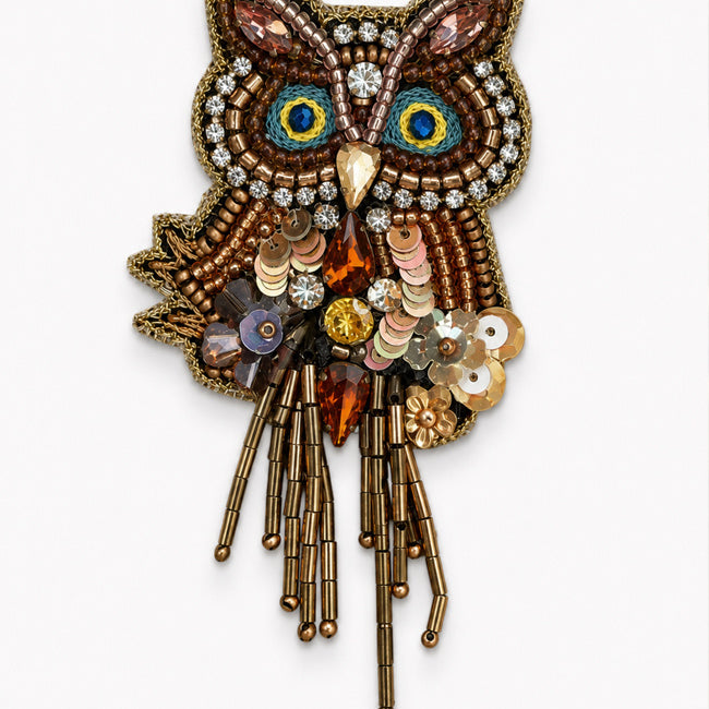 FAIRTRADE broche UIL met pailetten en kralen