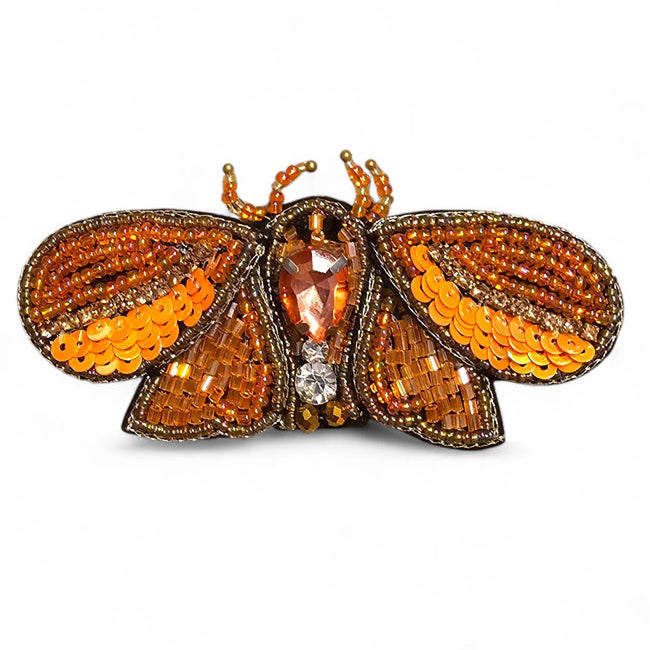 FAIRTRADE broche MOT ORANJE met pailetten en kralen
